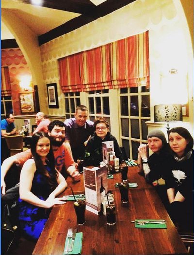 A family group around a table in a pub.